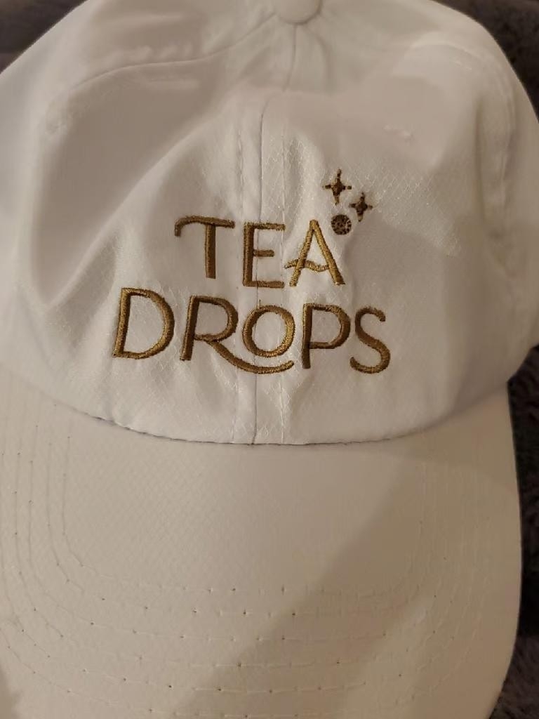 White Baseball Cap With Gold Embroidered Logo